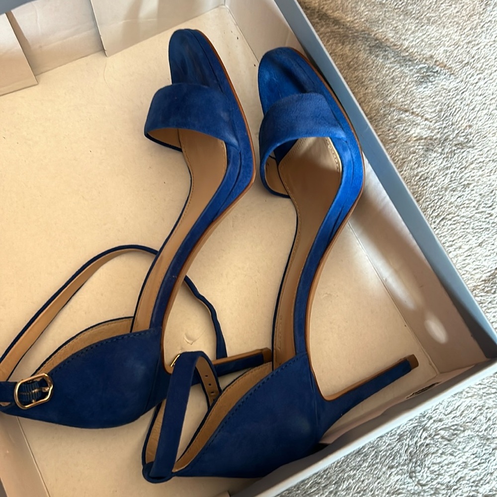 Blue suede high heel sandals.
